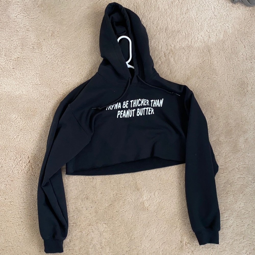 Cute cropped sweater saying “tryna be thicker than peanut butter”